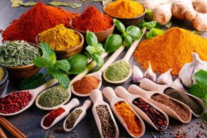 Variety of spices and herbs on kitchen table